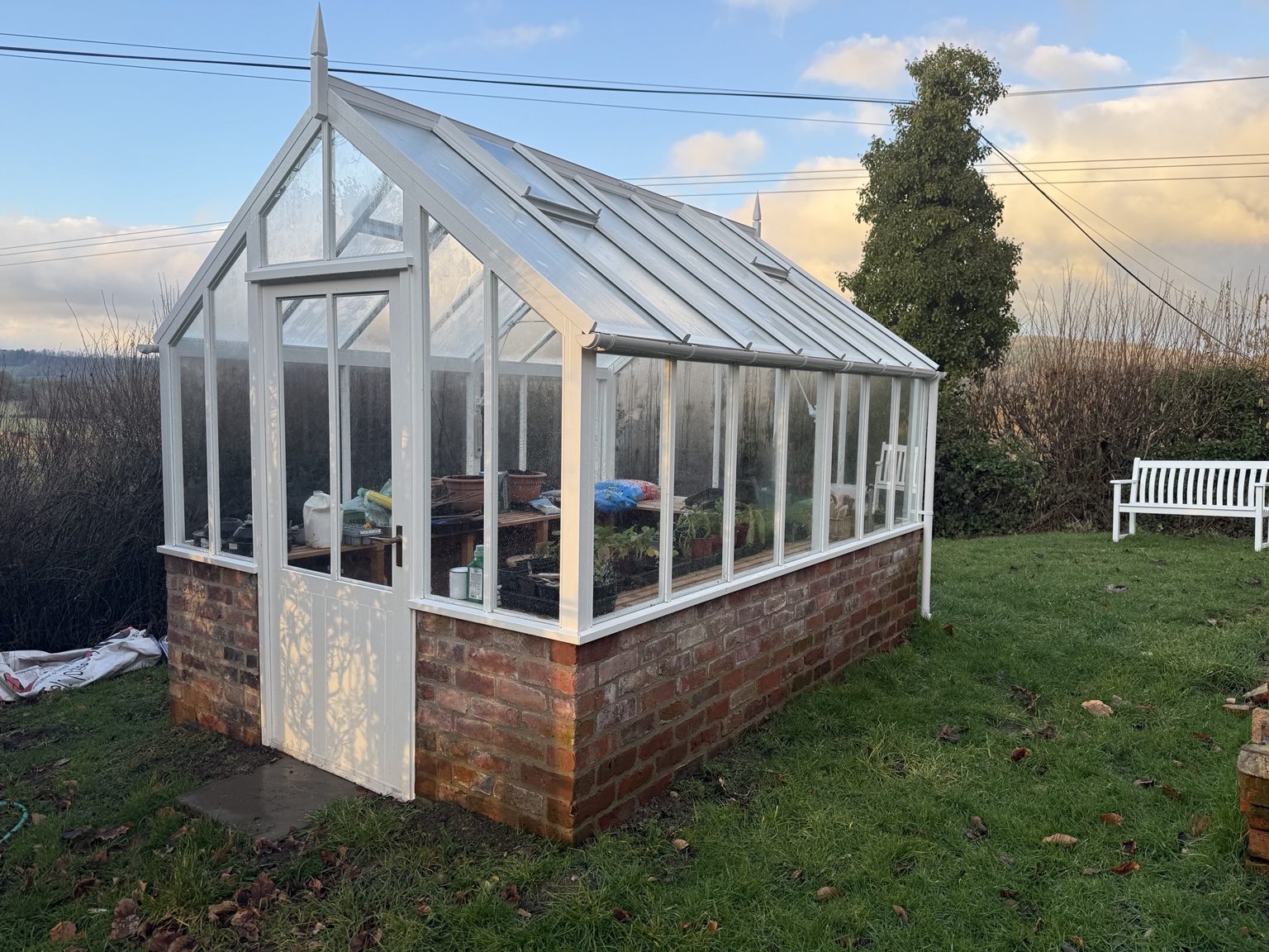 Brick base greenhouse masonry